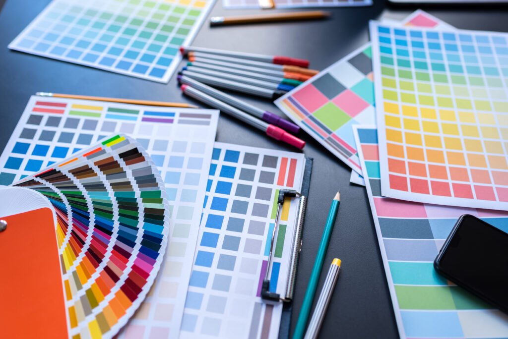 Color Swatches with many objects put on black working desk